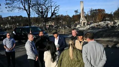 Getty Images Trump meets with residents near the ruins