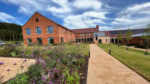 Shaun Whitmore/BBC The Priscilla Bacon Lodge