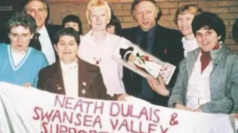 Michaela Hawkins Arthur Scargill being presented with a Welsh doll