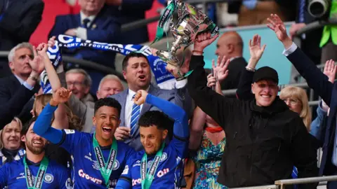 PA Media Rochdale manager Jimmy McNulty (right) lifts the trophy after winning the Enterprise National League Final at Wembley Stadium