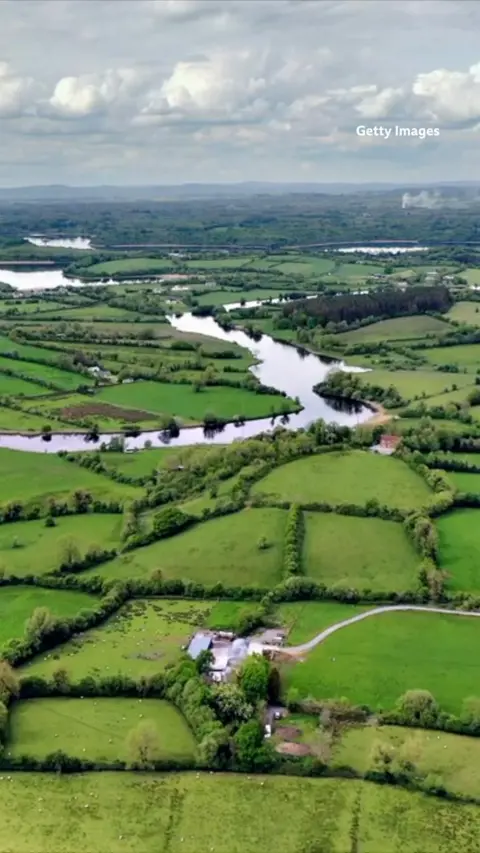 An aerial shot of some fields. 