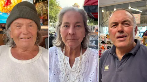 A composite image showing three people looking directly at the camera. On the left is John Crown, wearing a white, ribbed top and a khaki green bobble hat. His wavy grey hair is falling below the rim of the hat and is touching his collar. In the middle is Helen Anderson, who is wearing a white, lacy top. She has two strings of pearls hanging around her neck and has wavy grey hair, worn down almost to her shoulders. Dean Gardiner in the right and is wearing a blue collared t-shirt. He has short greying hair.