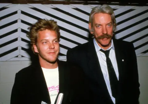 Getty Kiefer Sutherland (left) and his father Donald in the 1980s