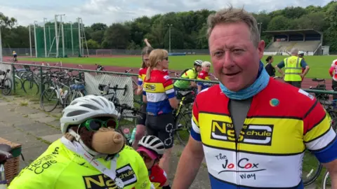 Steve Fox and his mascot Clyde, a toy monkey