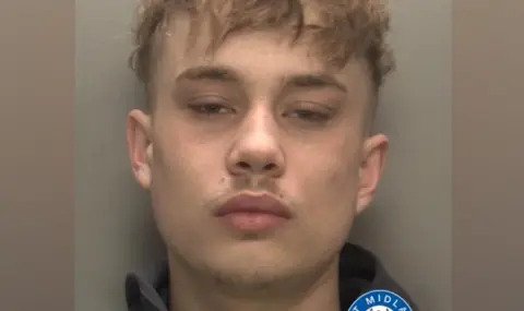 West Midlands Police A man with brown hair is looking at the camera in this image from police. Part of the West Midlands force's logo is visible near the bottom right corner.