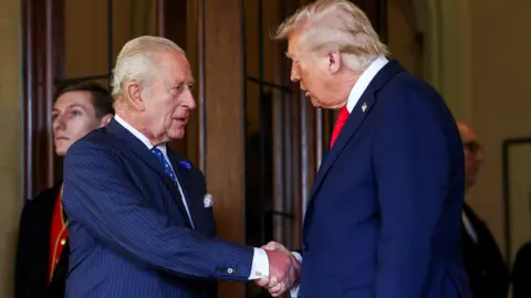 King Charles and President Trump shaking hands while the president was on a trip to the UK in September.