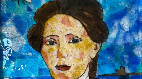 Debra Tracey A painting of a woman with a striking face. She has short, brown hair and she is in front of the Tower of Refuge. The background of the painting is blue.
