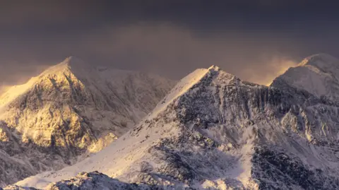 Richard Smith Snow sits on top the mountains on Yr Wyddfa, also known as Snowdon. 