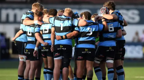 Cardiff players in a huddle