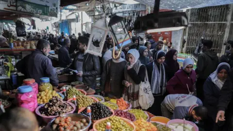 Getty Images The Palestinians shop in the old Zawa market on the second day of the holy month of Ramadan, in Gaza City, on Sunday, March 2, 2025.