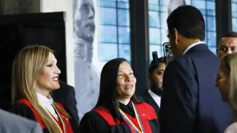 Getty Images nezuelan President Nicolas Maduro greets the President of the Venezuela's Supreme Court of Justice Caryslia Rodriguez upon his arrival at the TSJ headquarters in Caracas, Venezuela on July 31, 2024.