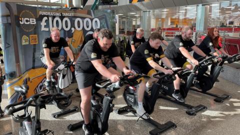 JCB workers cycling