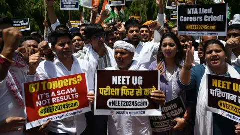 Getty images JUNE 9: Indian Youth Congress workers protest against the alleged irregularities in the NEET-UG examination, at IYC office, on June 9, 2024 in New Delhi, India. The National Eligibility-cum-Entrance Test (NEET-UG) has faced several allegations of irregularities and paper leak after 67 students topped the exams this year scoring a percentile of 99.997129. (Photo by Salman Ali/Hindustan Times via Getty Images)
