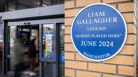 Lidl Lidl spoof plaque outside its store in Newton Heath