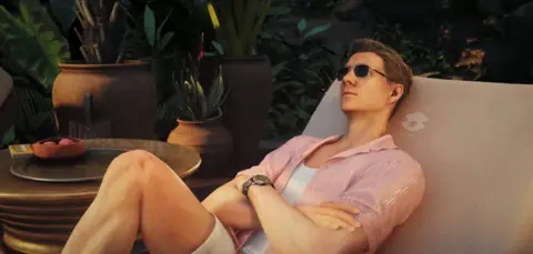 IO Interactive A still image from 007 First Light shows James Bond reclining on a sunlounger in a tropical setting.