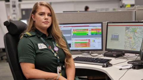 Abbie Williams sat at her desk in the control room 