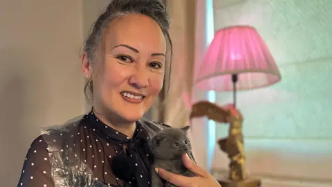 Frankie Seaman holding a grey kitten