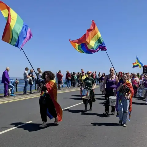 The first Arran Pride march taking place in 2022.