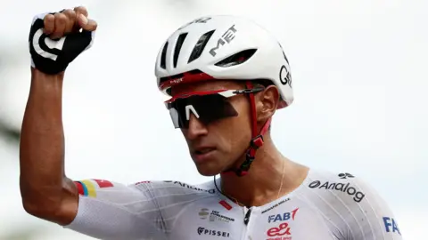 Ecuador's Jhonatan Narvaez holds his are up as he celebrates winning stage eight of the Giro d'Italia
