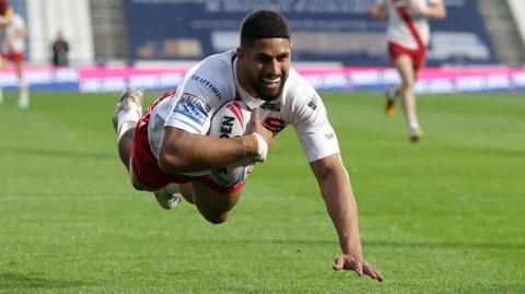 Nene Macdonald scores a try for Salford against Huddersfield