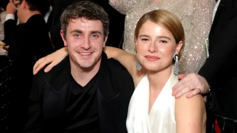 Getty Images Paul Mescal and Jessie Buckley attend at the 31st Annual Critics Choice Awards in Santa Monica, California, earlier this month. Mescal is in a black jacket, while Buckley is wearing a white dress.