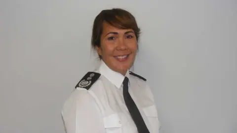 Buckinghamshire Fire and Rescue Service chief Louise Harrison in a white uniform with a black tie