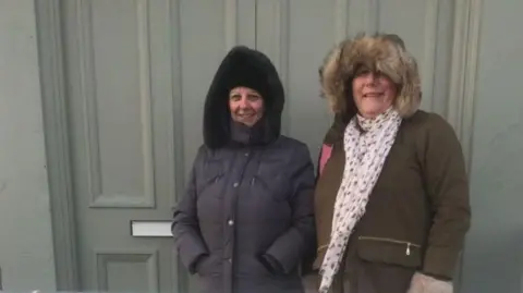 Lorraine Barnard Mary Wilson and Lorraine Barnard at the newly-opened Dreamland in Margate in 2015. Both have their hoods up.