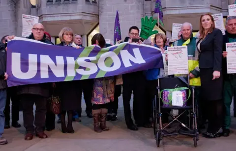 Alamy Angela Rayner with members of Unison and protesters from Save Our Ambulance Service on their way to the Department of Health. They hold a purple sign reading Unison.