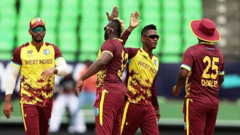 Akeal Hosein celebrates taking a wicket for West Indies against Papua New Guinea at the Men's T20 World Cup
