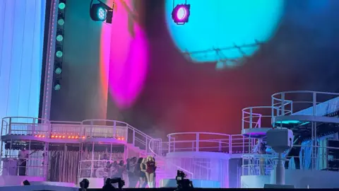 Picture of stage with Sabrina Carpenter on it