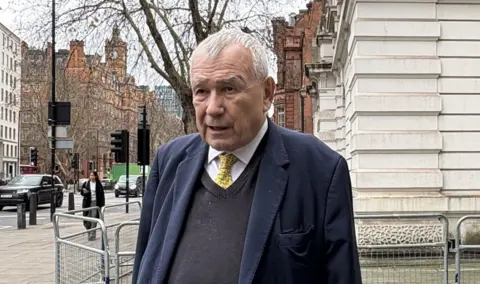Lord Tim Razzall leaves Westminster Magistrates Court in London, where he was handed a two-week discretionary disqualification after pleading guilty to driving through a red light. 
