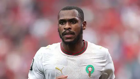 Issa Diop in action for Morocco