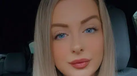 Catrin Edwards A woman smiles at the camera 