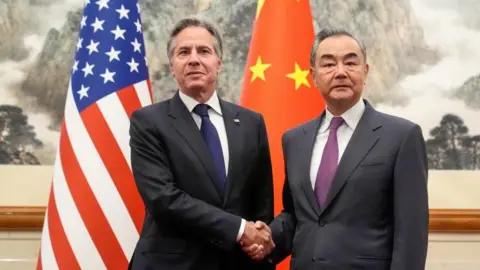 US Secretary of State Antony Blinken, left, meets with China's Foreign Minister Wang Yi at the Diaoyutai State Guesthouse