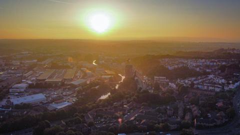 Sun rising over Bristol landscape