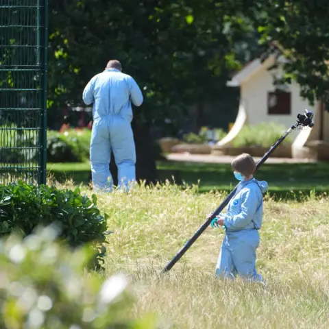 PA Media Police scenes of crime officers (SOCOs) gathers evidence at Plashet Park