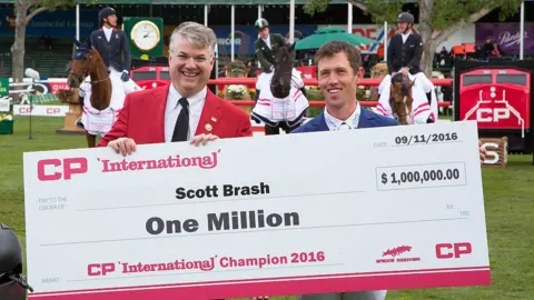 Getty Images Scott Brash with winning cheque