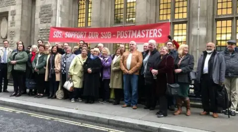 Postmasters and mistresses staging a protest