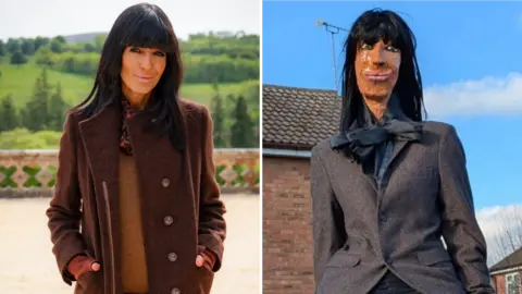 BBC/Studio Lambert/Euan Cherry / Sharon Kulesa Image of Claudia Winkleman on the set of The Traitors castle. She has brown hair and a large fringe and is smiling to the camera. It is next to an image of her as a papier mache model - in a grey jacket. 