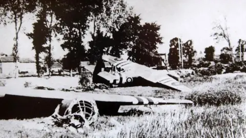 PA Media Black and white image of gliders lying in field