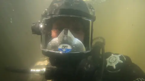 Gary Bankhead An underwater image of Gary Bankhead in full diving gear. 