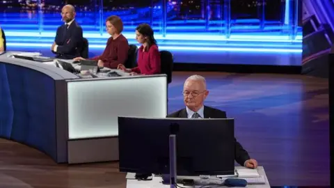 Matt Eaton from ABC News Antony Green pictured in front of a computer on set in Brisbane for the Queensland election night in 2024.