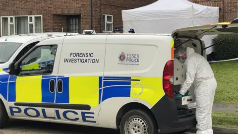 Stephen Huntley/BBC A police truck out of a property in Great Baddow. There is a forensic worker who stands next to the car trunk. In the background there is a forensic tent that has been presented.