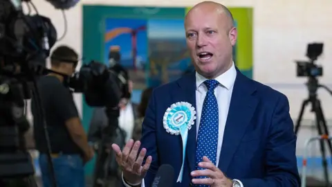 Getty Images Dan Thomas, leader of Reform in Wales speaks to the media after the Casnewydd Islwyn Senedd constituency vote count, at the Geraint Thomas National Velodrome, Newport. 