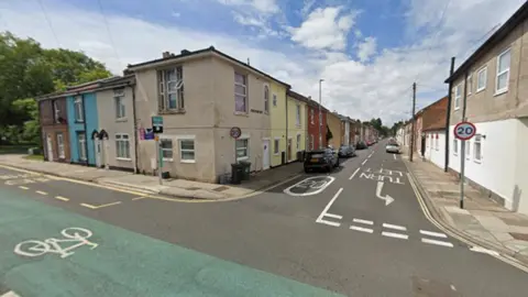 Google A Google streetview image of a narrow street of terraced houses