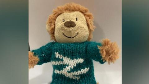 Monkey the teddy bear in a Network Rail jumper 