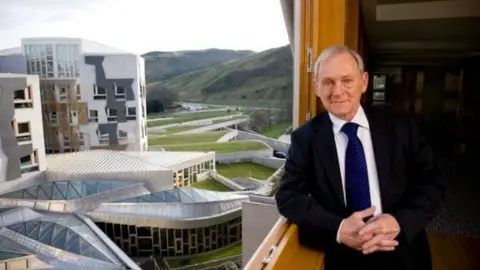Harry Benson Sir George with the new Holyrood Scottish Parliament building