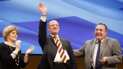 PA Media Deputy First Minister Nicola Sturgeon, MSP John Swinney and First Minister Alex Salmond during the last day of the 77th Scottish National Party annual conference at the Eden Court Theatre in Inverness.
