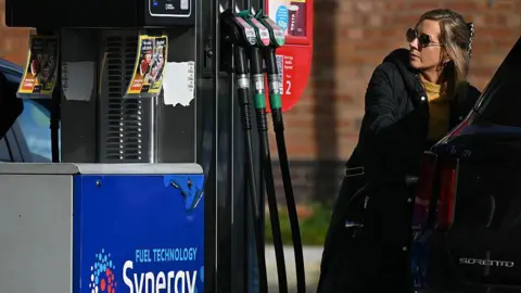 A motorist refuels a vehicle with diesel fuel at an Esso petrol station in Lutterworth, near Rugby in central England, on March 10, 2026.