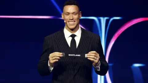 EPA Draw assistant Aaron Judge holds the ticket of Scotland during the FIFA World Cup 2026 Final Draw at the Kennedy Center in Washington DC, USA